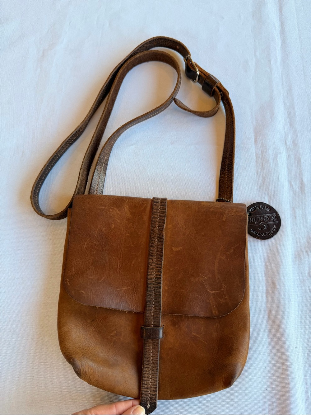 K.Bellum Full Grain Brown Leather Crossbody with Vertical Center Strap Closure